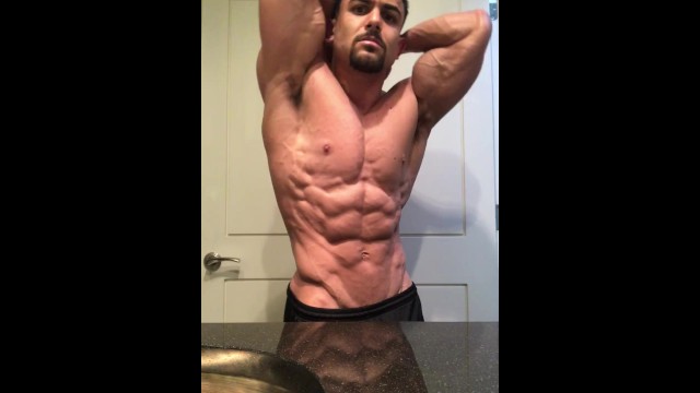 Jacked bodybuilder Benji Bastian flexing his huge, shredded, muscles